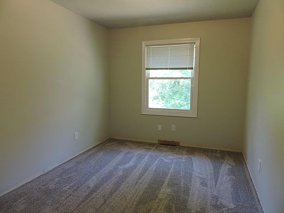 Bedroom #1. White baseboard trims have been installed.