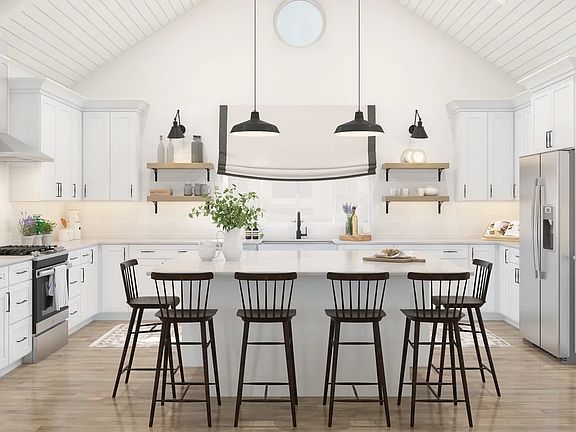 Kitchen with pendant lighting vaulted ceiling
