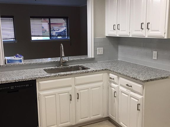 Kitchen and looking into family room