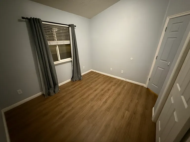 Bedroom 1 with vaulted ceilings