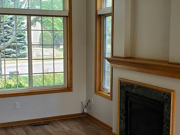 living room, natural gas fireplace, overhead fan & light