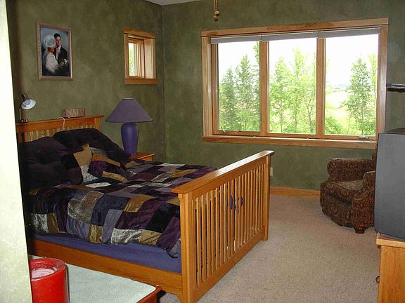 Master bedroom w/ enormous 8x12 shelved walk-in closet.