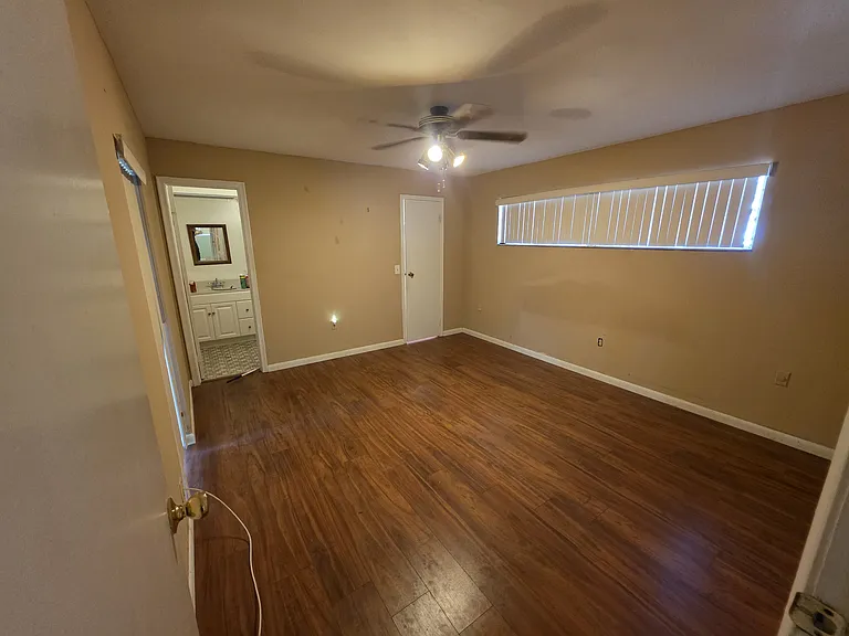 Master bedroom with a walking closet and bathroom.