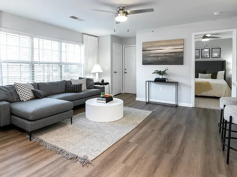 Discover sophistication in our generous open floor plans, boasting chic wood-style flooring and contemporary ceiling fan fixtures.