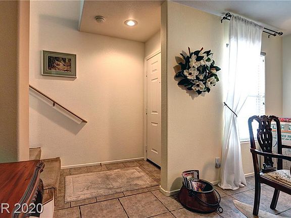 Front entrance: You begin in 1 of 2 living rooms. Stairs lead you upstairs to living room, kitchen and master bedroom.