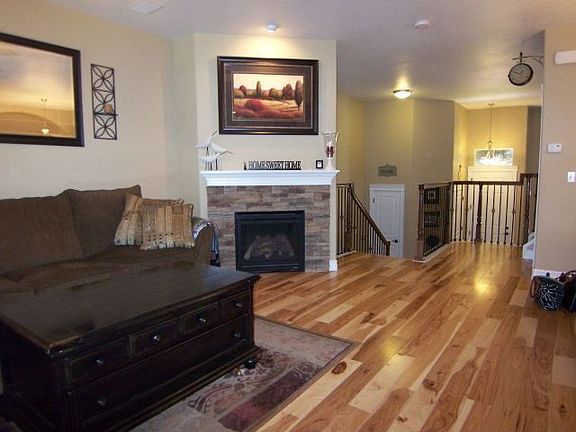 Spacious family rm w/ gas fireplace & attractive wide planked hardwood floors
