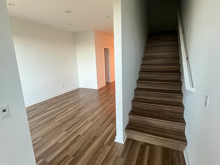 Nook, living room and stairs to the bedrooms.