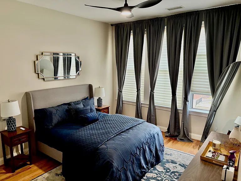 Large Bedroom w/ Wall of Windows! Silouette Blinds w/ New Curtains and Tie Backs! NEW LED Ceiling Fan w/ Remote!