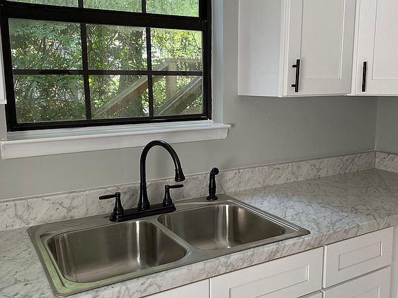 New kitchen cabinets, new kitchen countertops and new sink/faucet