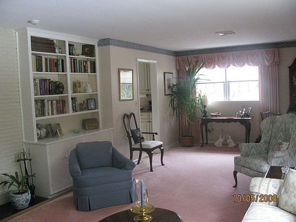 Formal Living rm w/built-in book case & FP