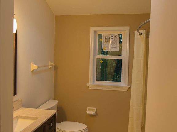 Bathroom 2- Travertine tile Quartz counter