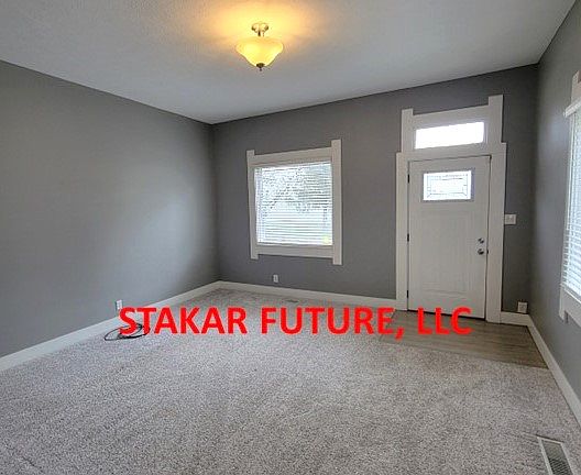 Nice sized living room, with large windows.