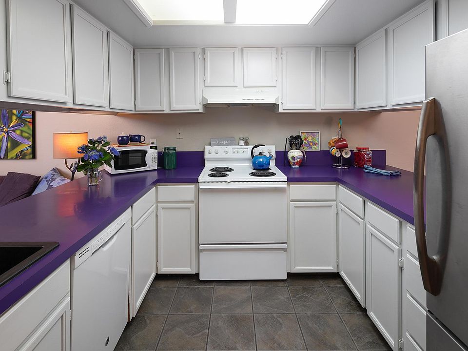 kitchen opens to the sitting room on one side and to the dining room on the other. makes for a super convenient open floor plan