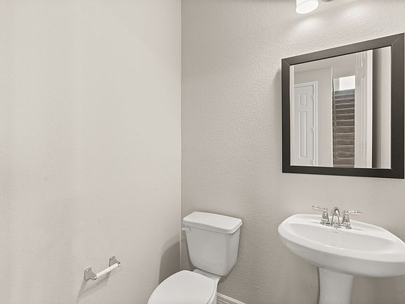 The powder room is conveniently located close to the main living space.