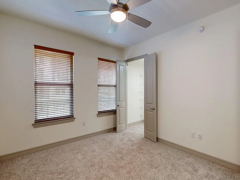 Spacious apartment Bedroom with Carpet Floor.