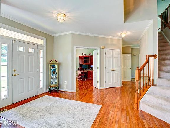Foyer with hardwood flooring