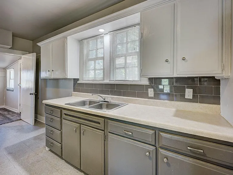 Kitchen looking into laundry