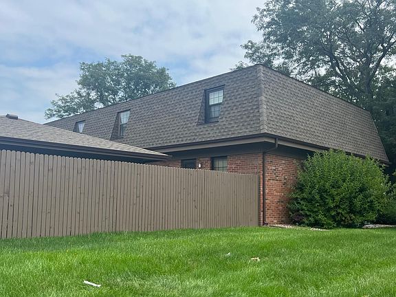 Outside view. Enclosed courtyard and roof of garage visible.