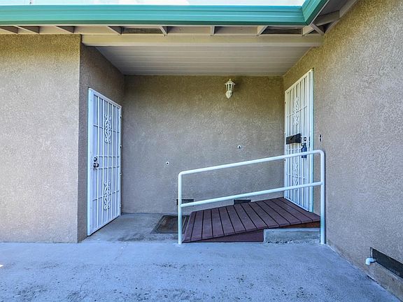 Door entrance to the garage and entry door to the home with ramp.
