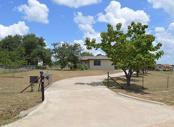 Fully fenced property with automatic gated entry, long drive