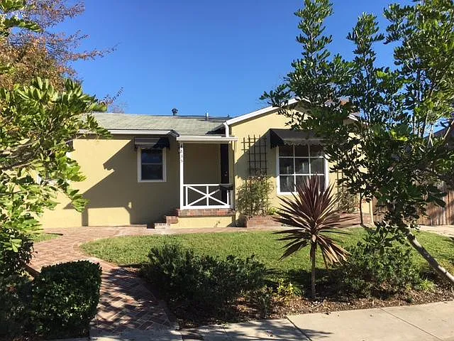 Photo of front house on lot. You can access the back house via either a walkway to the left of the house or through the alley.