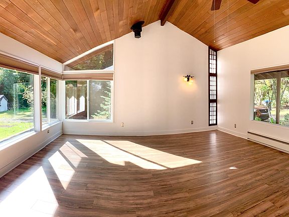 Charming Spacious Living room with beautiful floor and is full of light.