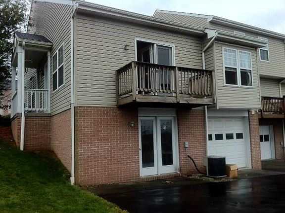 Back of unit- Back 1 car garage- walk out from family room