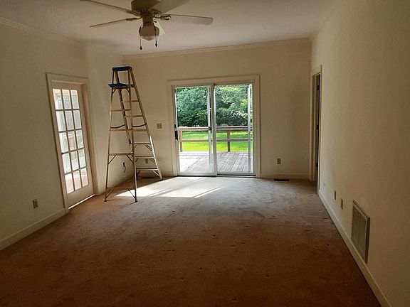 Master bedroom on first floor with deck access
