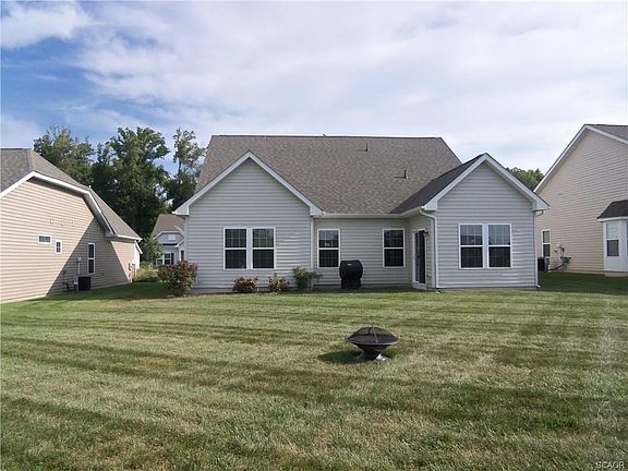 Large back yard and rear elevation of house