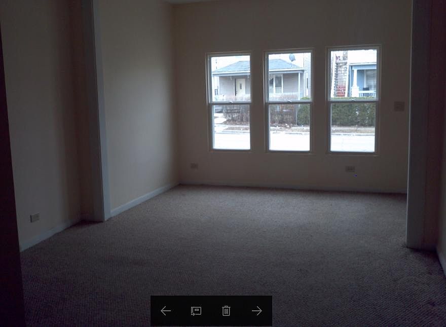 Living Room with large front windows for natural light