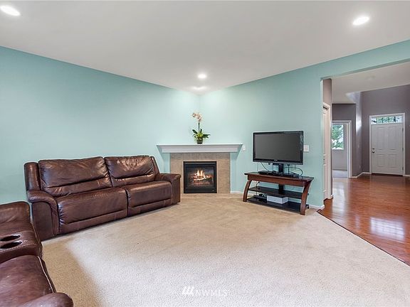 Cozy corner fireplace in the living room will be perfect for the fall evenings ahead. 