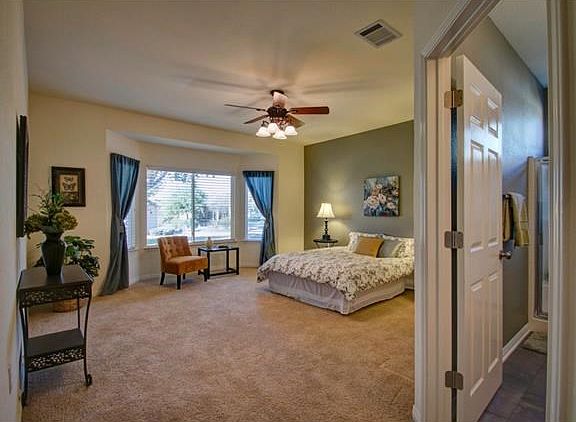 Master bedroom with full bath to right, and walk-in closet (not