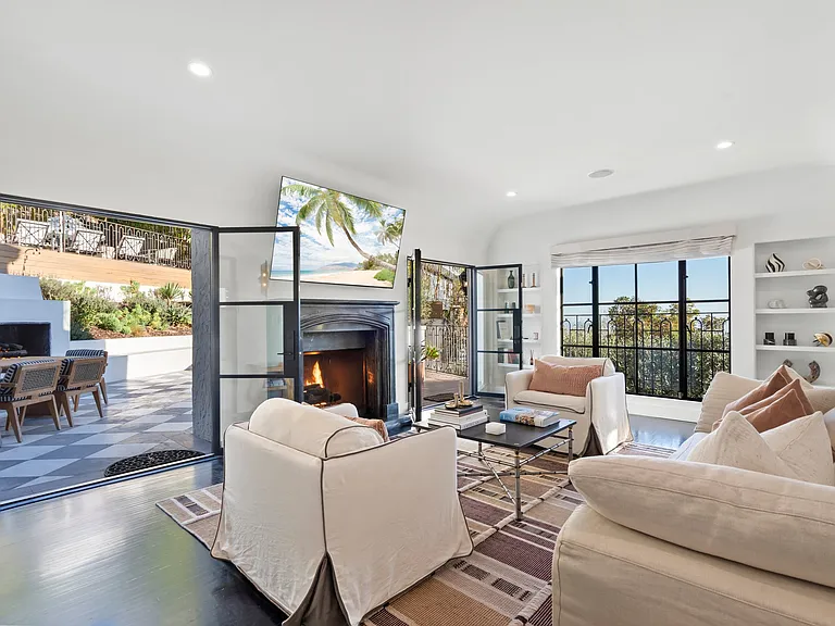 Relax by the fireplace and sink into the plush, designer seating.