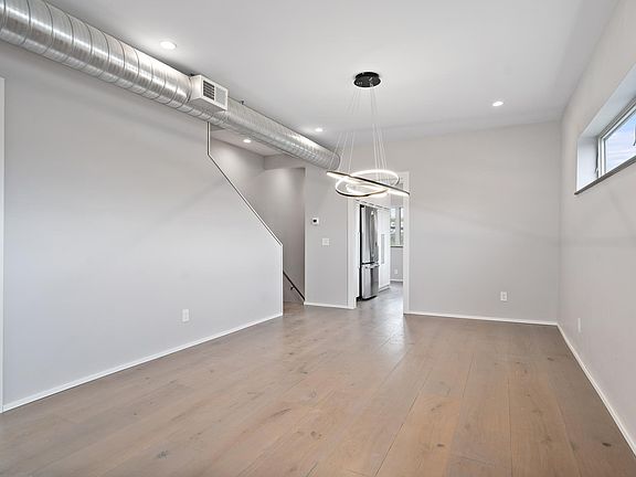Newly renovated throughout, the apartment is bright and airy with neutral paint colors and warm, wide-plank wood floors.