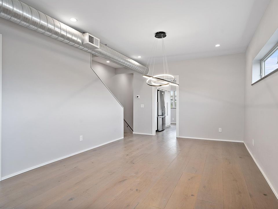 Newly renovated throughout, the apartment is bright and airy with neutral paint colors and warm, wide-plank wood floors.