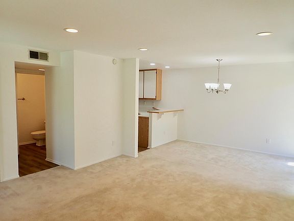 Downstairs guest bath, and dining area from living room