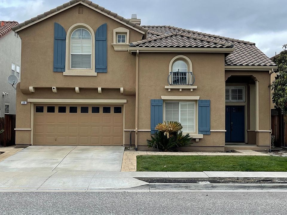 Single-family home with a well-maintained backyard and fruit trees