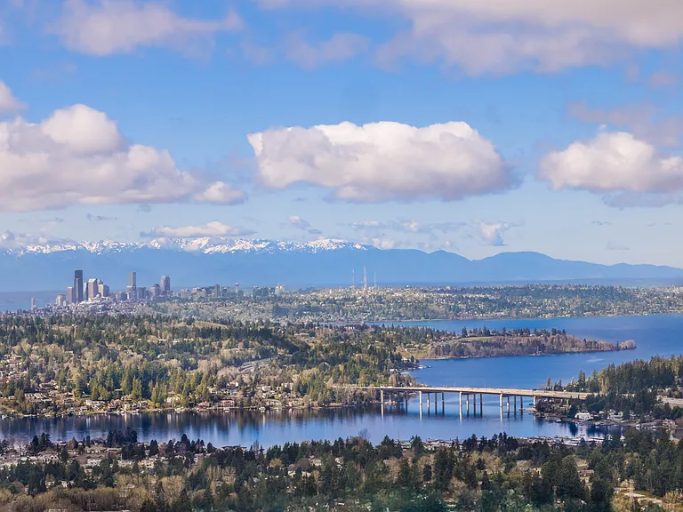 This aerial shot showcases breathtaking views of the city skyline, with a mix of urban energy and waterfront beauty.