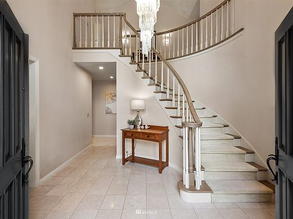Magnificent Foyer -- Italian marble tile & crystal chandelier.>