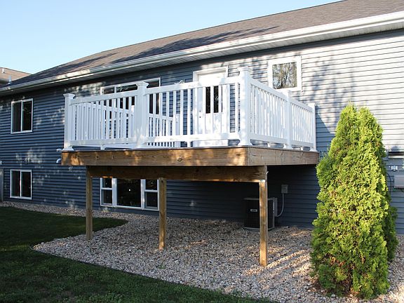 Back of property with walk-out deck
