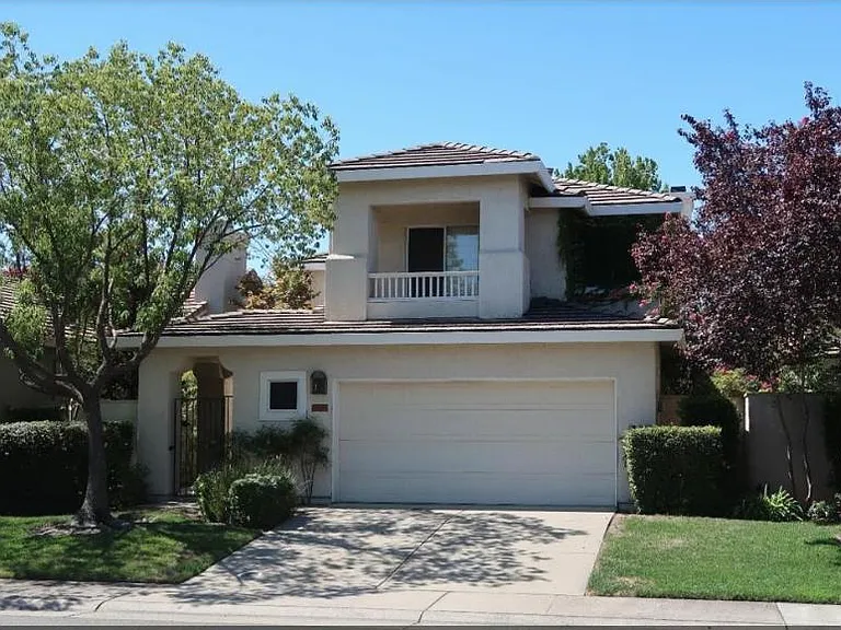 front of the house and upstairs balcony.