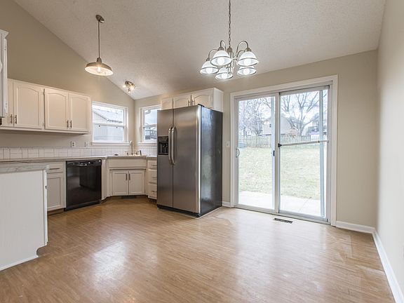 Eat-in Kitchen - all new light fixtures.