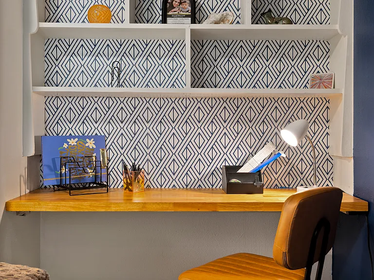 Bedroom three's work space complete with rolling chair.