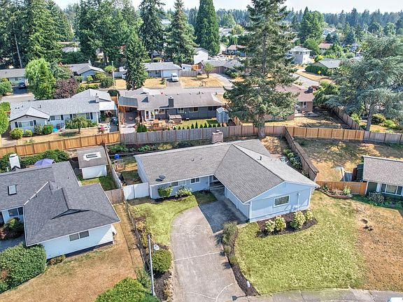 Solid home with new exterior paint and new gutters.>