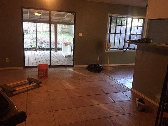 Living room, bar near right, dining far right