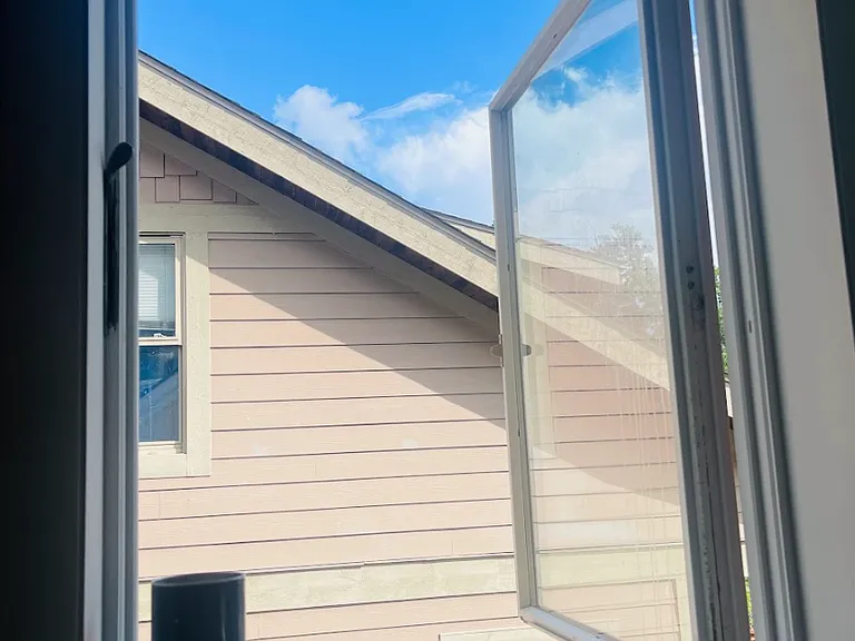 All the windows open. This is the window at the top of the stairs outside the upstairs half-bath