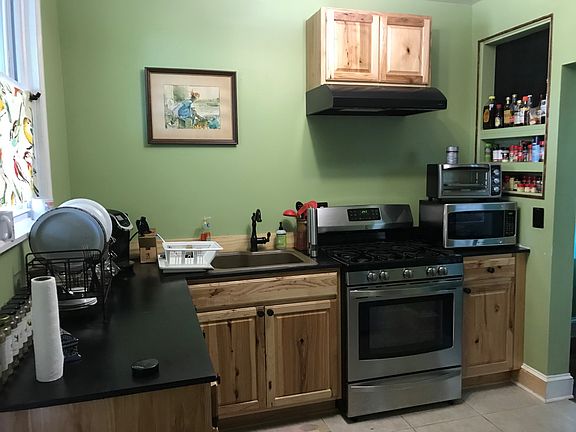 Nice sizes kitchen, pantry for storage, gas stove, refrigerator. Cabinet have pull out storage racks, back door leads to deck.