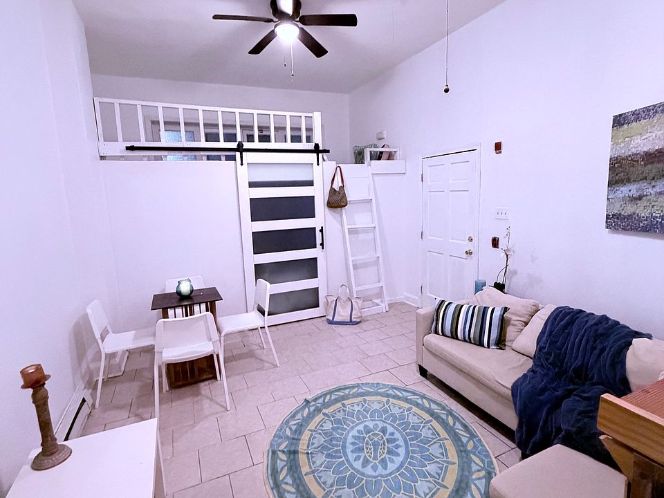 Very high ceilings with private bedroom area and loft space. Modern frosted barn door!