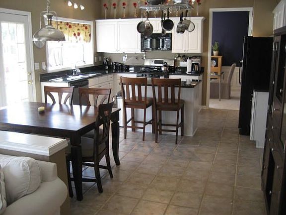 The kitchen is newly updated with SS appliances, granite, paint.