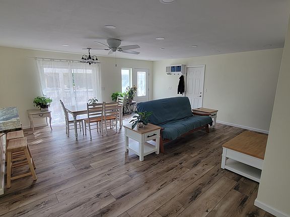 View of the LR/DR from the door to the main house. The big glass door and entrance door flood the room with light all day. The door to the right of the coat rack leads to the garage and will be locked/blocked as the garage is not part of the rental offer